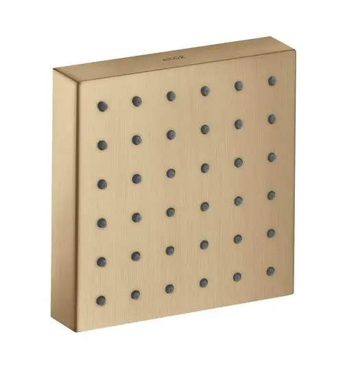 Brausesystem von AXOR mit quadratischem Design, Effektauslassrohre in Schwarz, montiert auf einer flachen, gebürsteten Bronzeplatte.